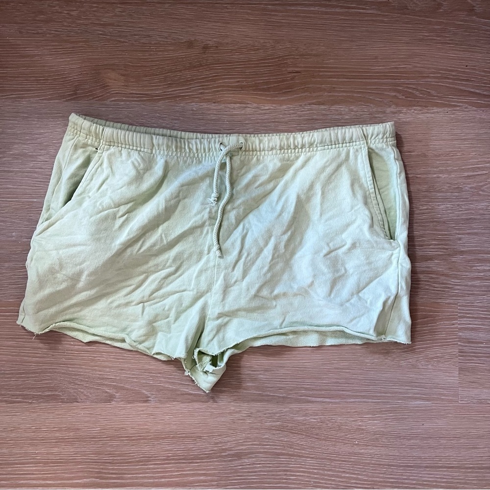 Cut off green drawstring sweat shorts from altard state